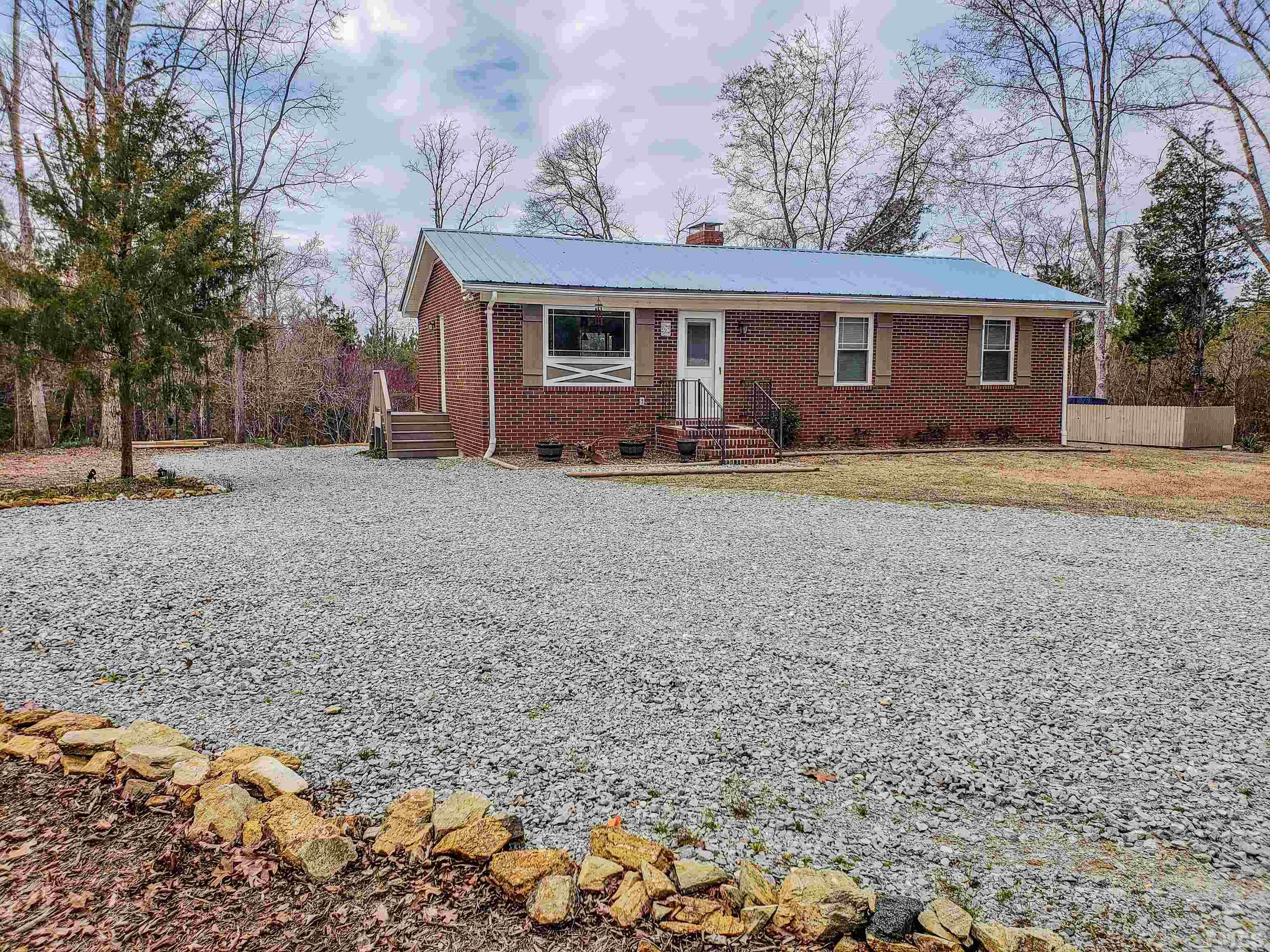 155 Alva Oakley Road Roxboro, NC 27574 - Photo 42 of 42 a view of a yard in front of a house