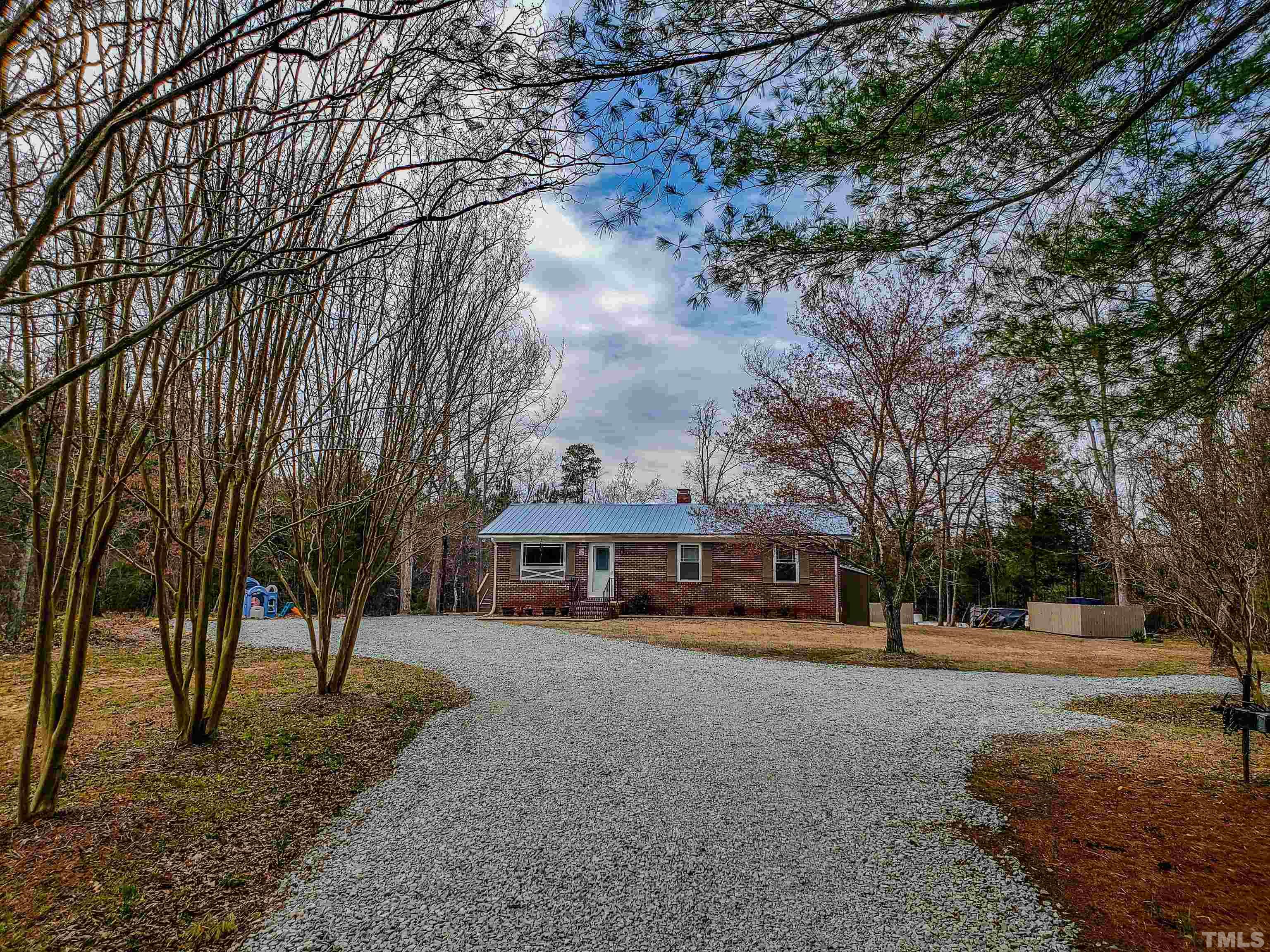155 Alva Oakley Road Roxboro, NC 27574 - Photo 7 of 42 a view of a town with large trees