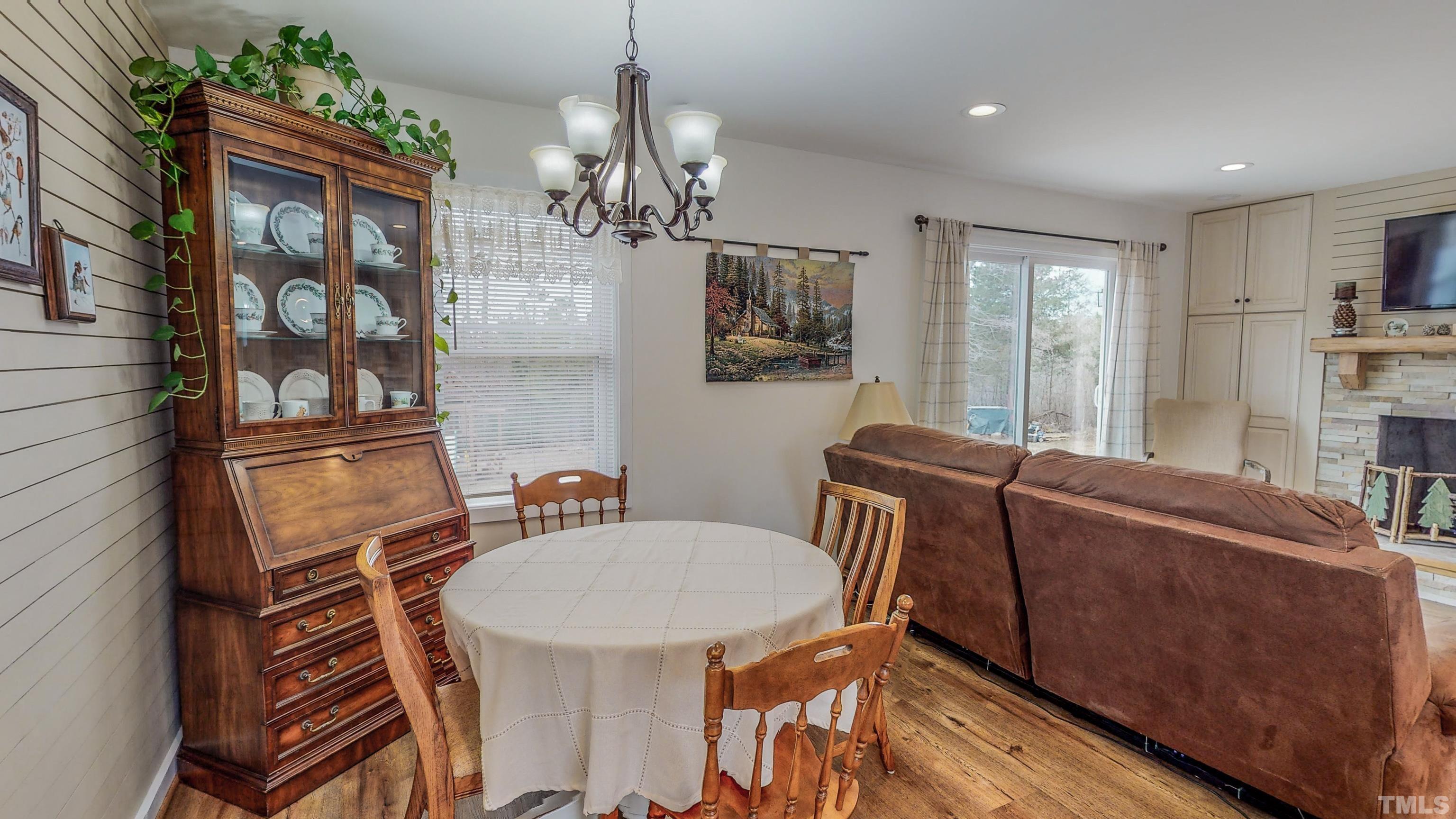 155 Alva Oakley Road Roxboro, NC 27574 - Photo 9 of 42 a view of a dining room with furniture window and wooden floor