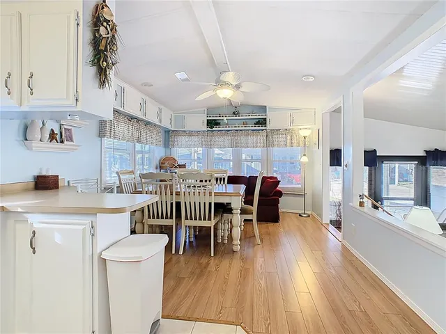 a dining room with furniture and wooden floor