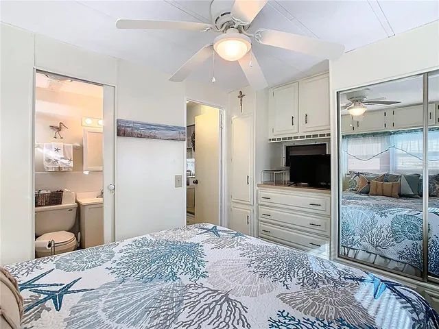 a bedroom with a bed and a view of bedroom