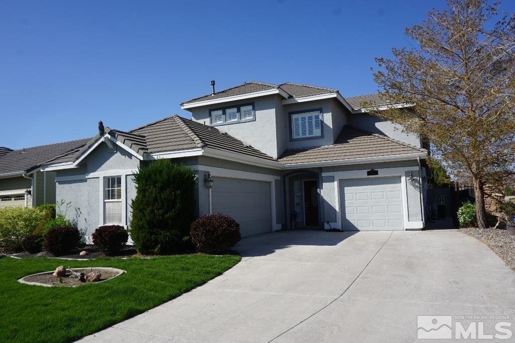 1611 Quail Bar Court Reno, NV 89521 - Photo 1 of 17 a front view of a house with a garden and plants