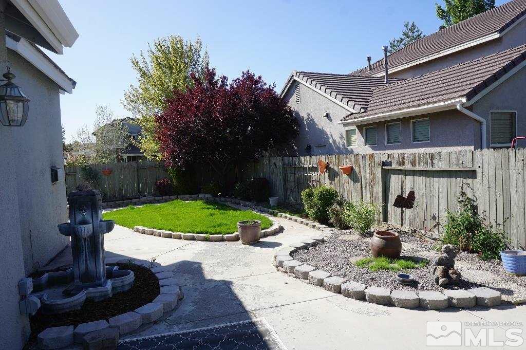 1611 Quail Bar Court Reno, NV 89521 - Photo 13 of 17 a front view of a house with a yard