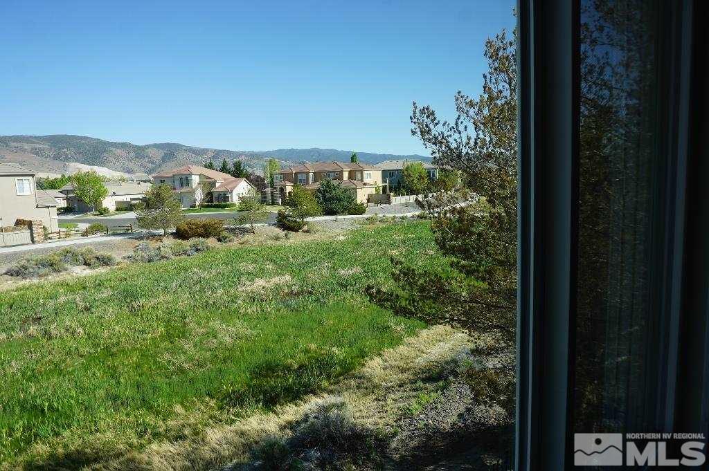1611 Quail Bar Court Reno, NV 89521 - Photo 15 of 17 a view of a house with a yard