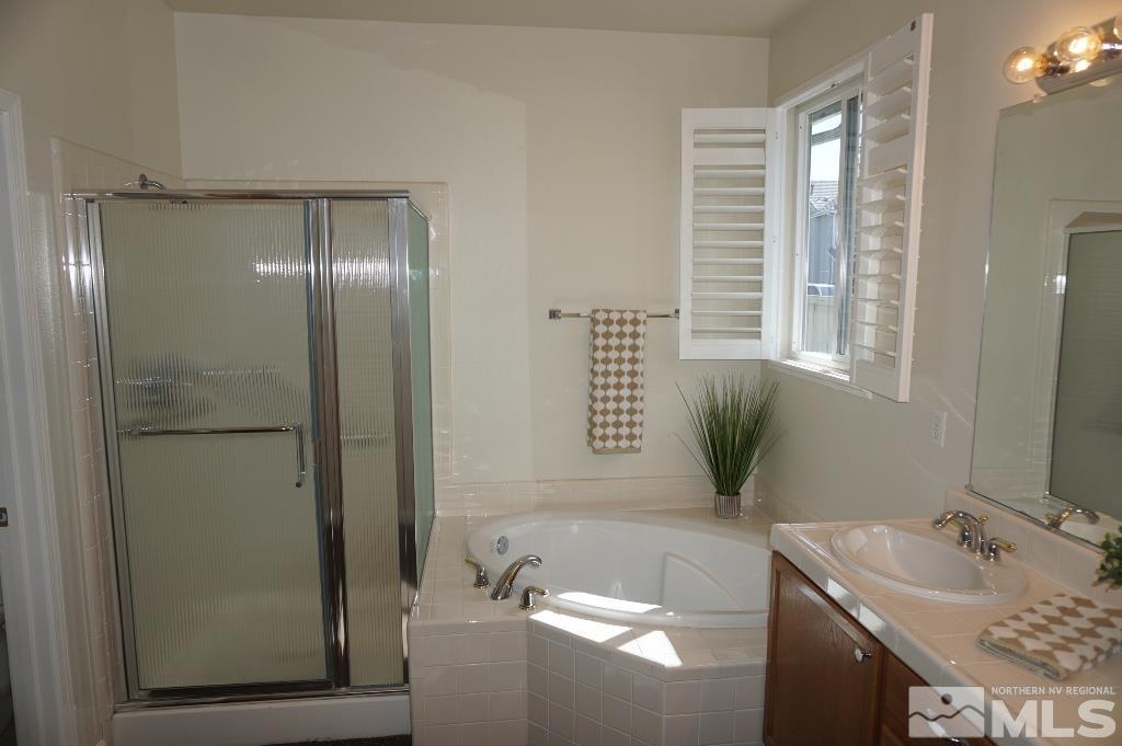 1611 Quail Bar Court Reno, NV 89521 - Photo 7 of 17 a bathroom with a bathtub and a sink