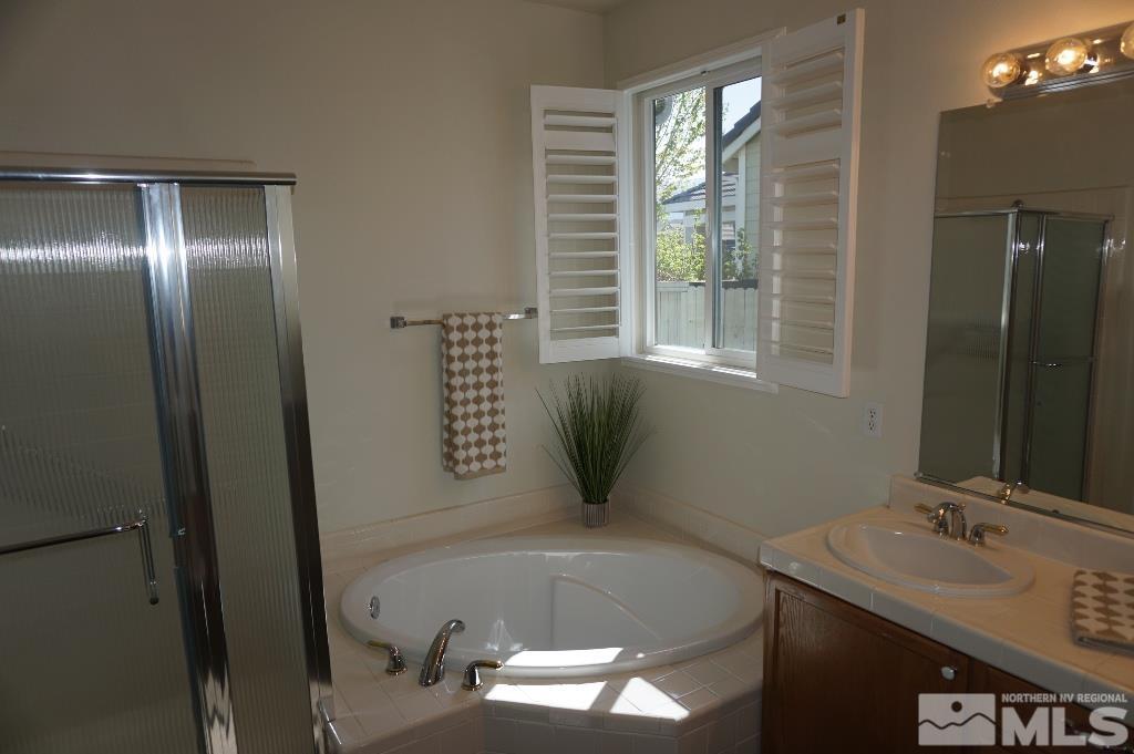 1611 Quail Bar Court Reno, NV 89521 - Photo 8 of 17 a bathroom with a sink and a mirror