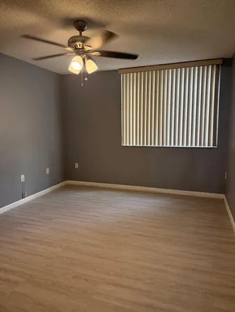 a view of an empty room with a window