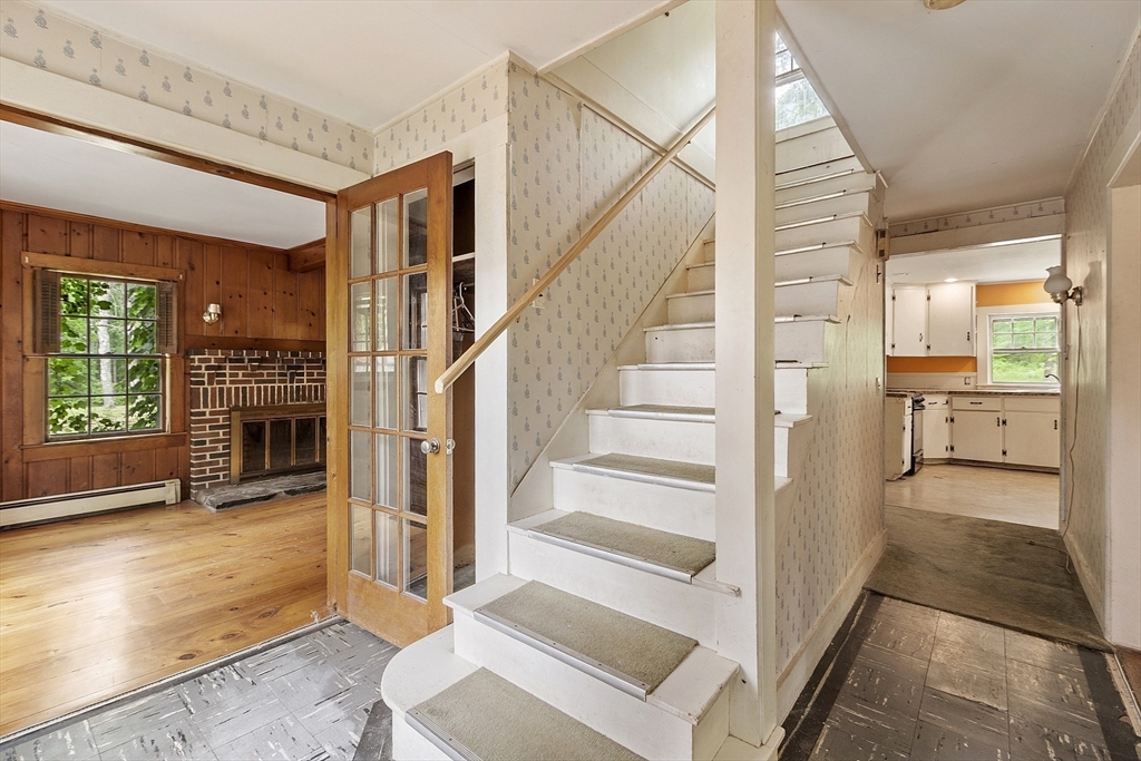22 Haynes Road Townsend, MA 01469 - Photo 13 of 24 a view of a hallway view with wooden floor and staircase