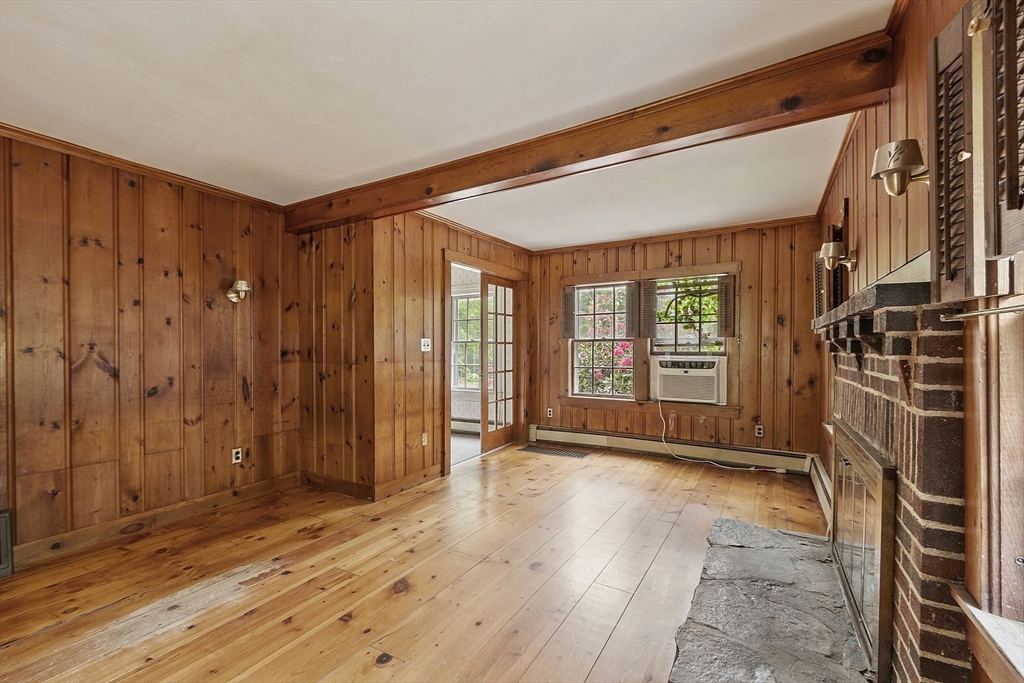 22 Haynes Road Townsend, MA 01469 - Photo 4 of 24 a view of an empty room with a fireplace and a window