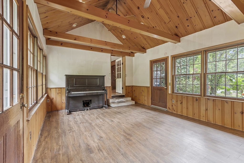 22 Haynes Road Townsend, MA 01469 - Photo 5 of 24 a living room with furniture a flat screen tv and next to a window