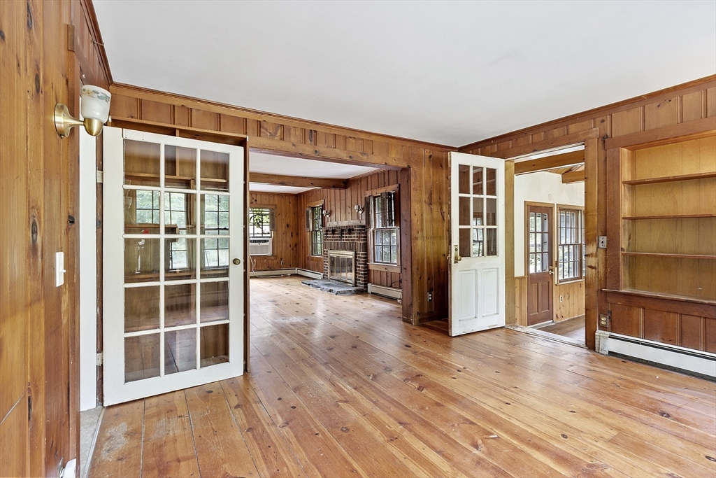 22 Haynes Road Townsend, MA 01469 - Photo 6 of 24 a view of empty room with wooden floor and windows