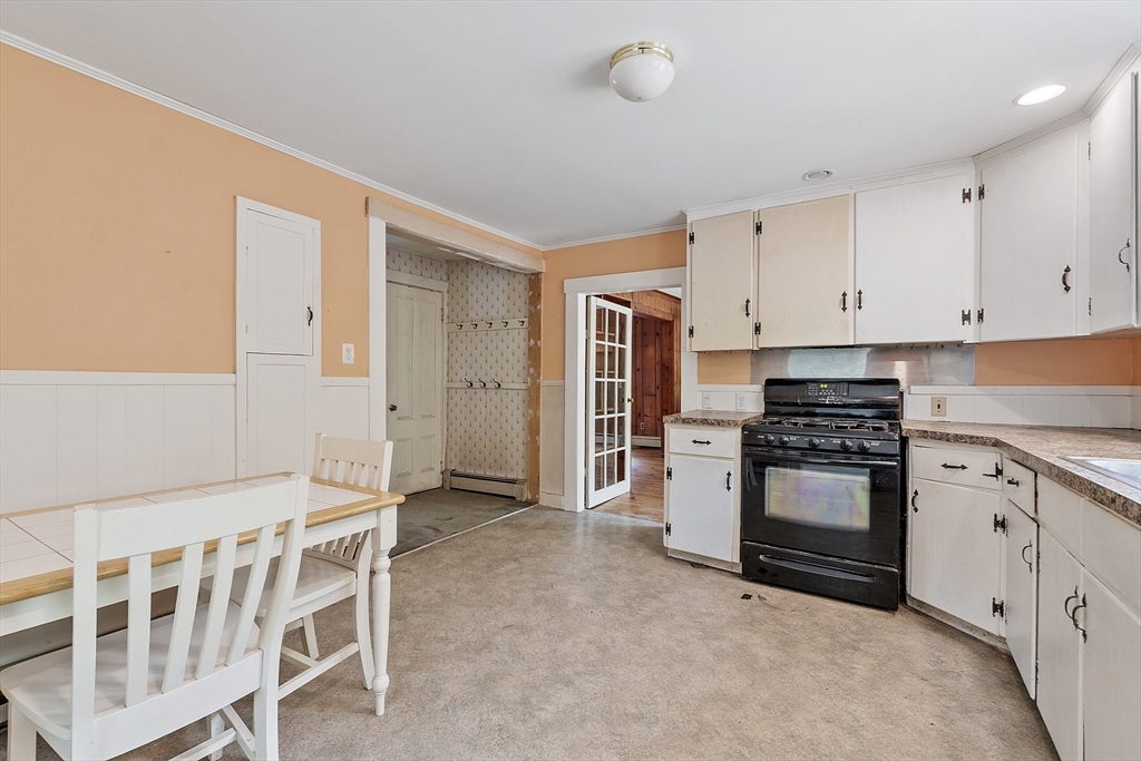 22 Haynes Road Townsend, MA 01469 - Photo 8 of 24 a kitchen with granite countertop a stove a sink and a refrigerator