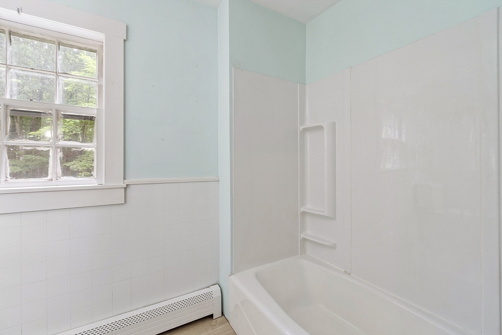 22 Haynes Road Townsend, MA 01469 - Photo 10 of 24 a bathroom with a bathtub