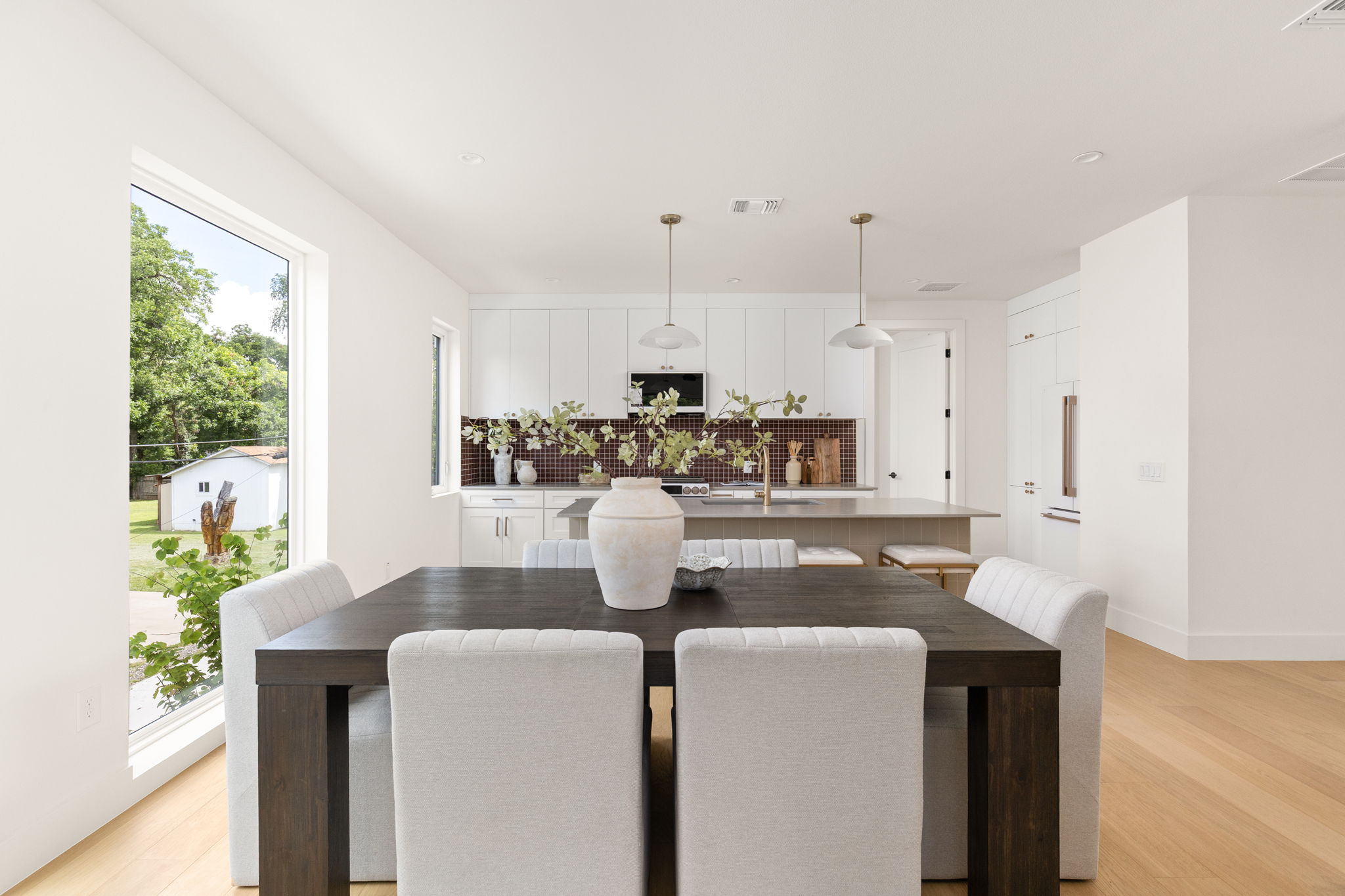 732 Springdale Road, Unit A Austin, TX 78702 - Photo 6 of 18 An open concept design seamlessly connects the dining area with a modern, well-appointed kitchen.
