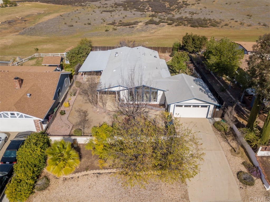 34786 The Farm Road Wildomar, CA 92595 - Photo 1 of 1 an aerial view of residential houses with outdoor space