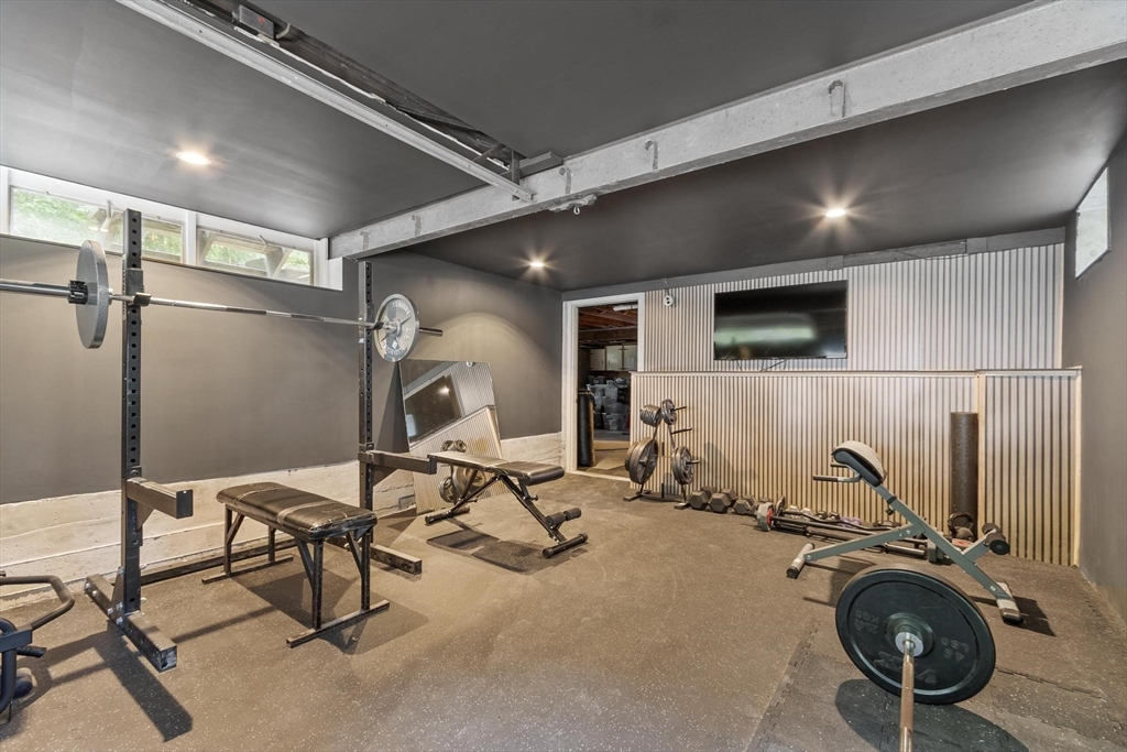 167 Gates Pond Road Berlin, MA 01503 - Photo 31 of 32 a view of a room with gym equipment
