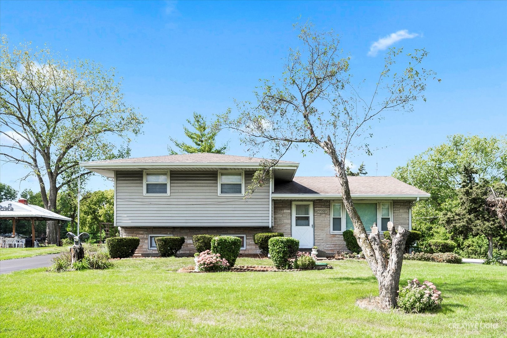 23061 South Frontage Road West Channahon, IL 60410 - Photo 13 of 13 a front view of a house with a yard