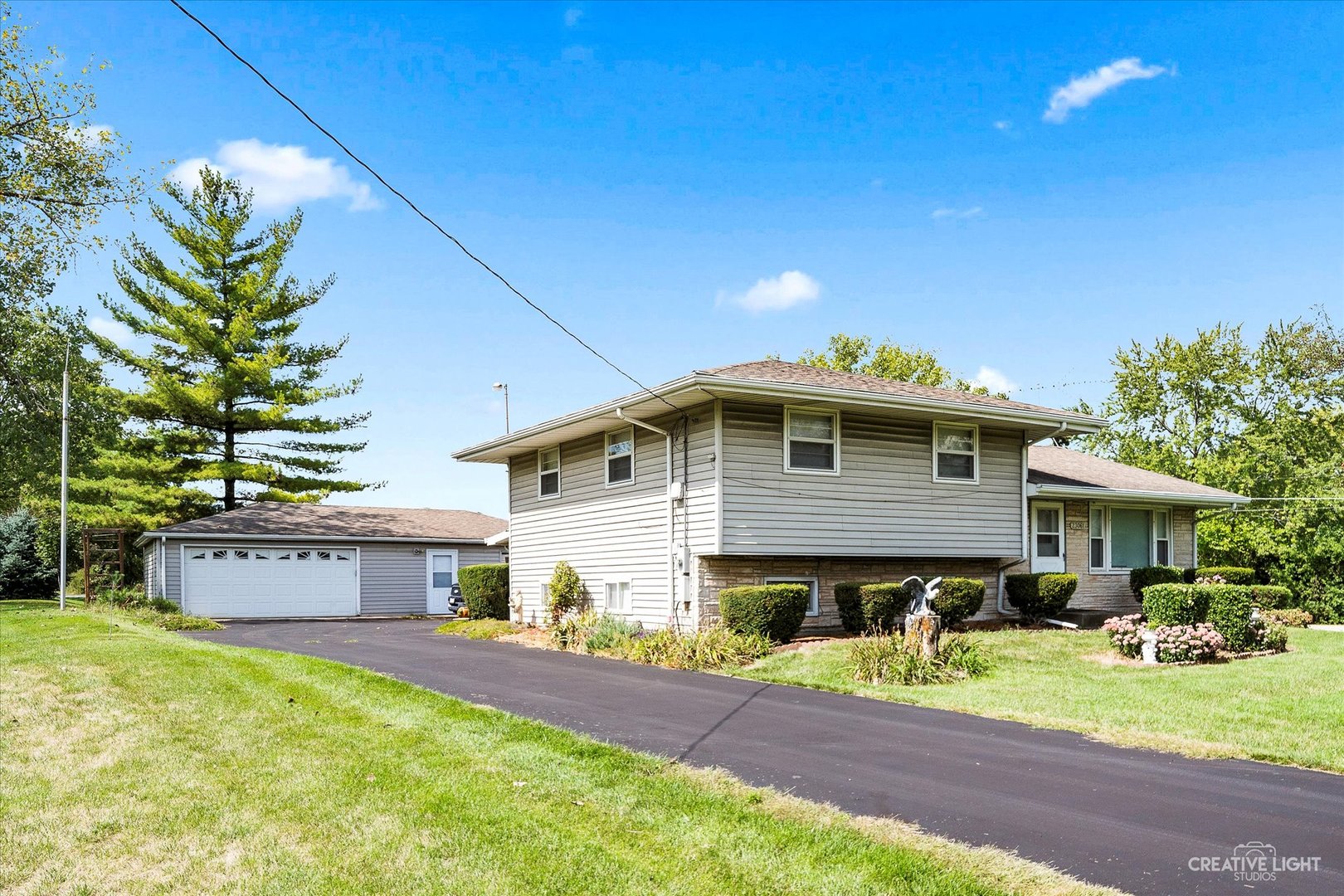 23061 South Frontage Road West Channahon, IL 60410 - Photo 2 of 13 a front view of a house with a yard