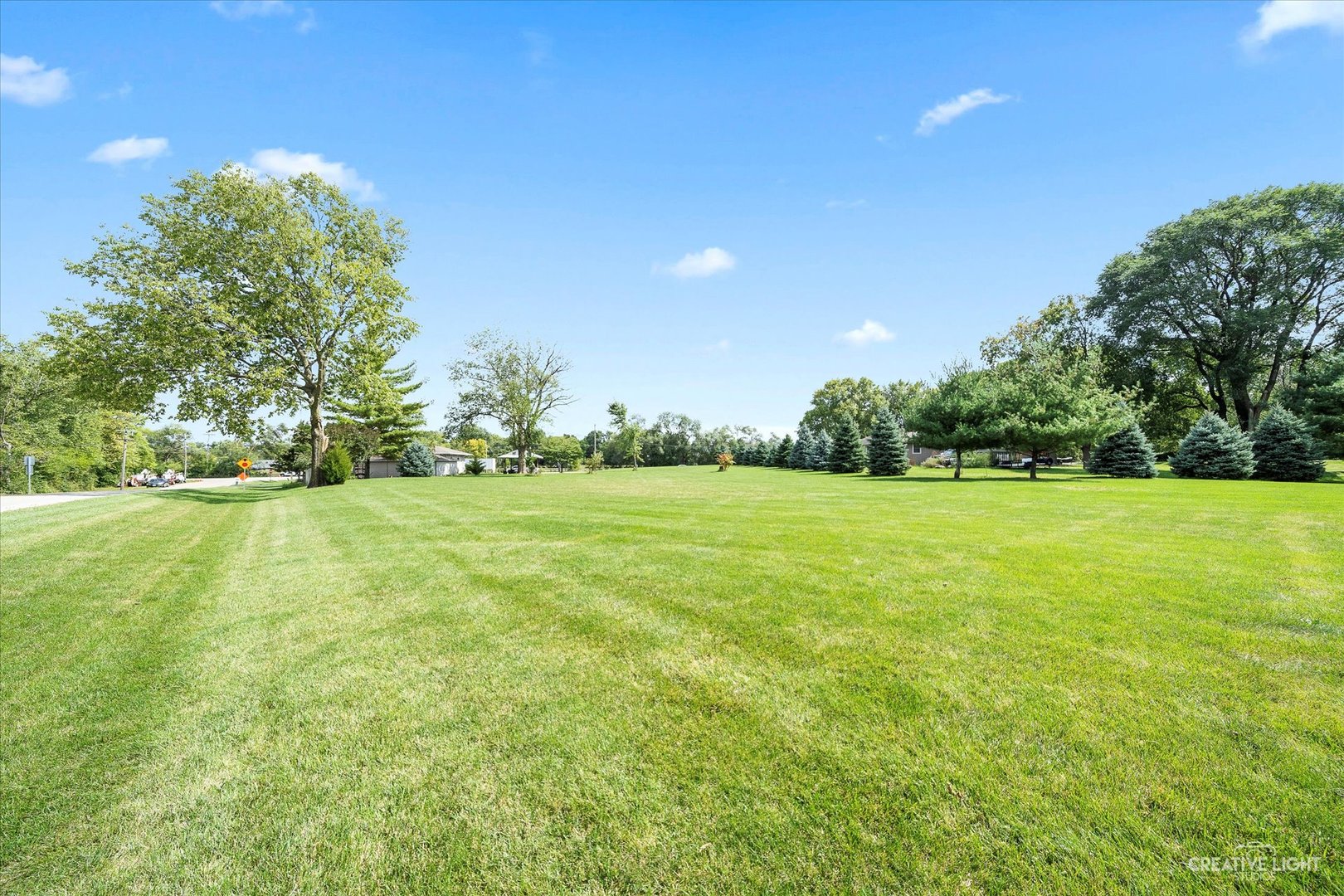 23061 South Frontage Road West Channahon, IL 60410 - Photo 7 of 13 a view of a green field with wooden fence
