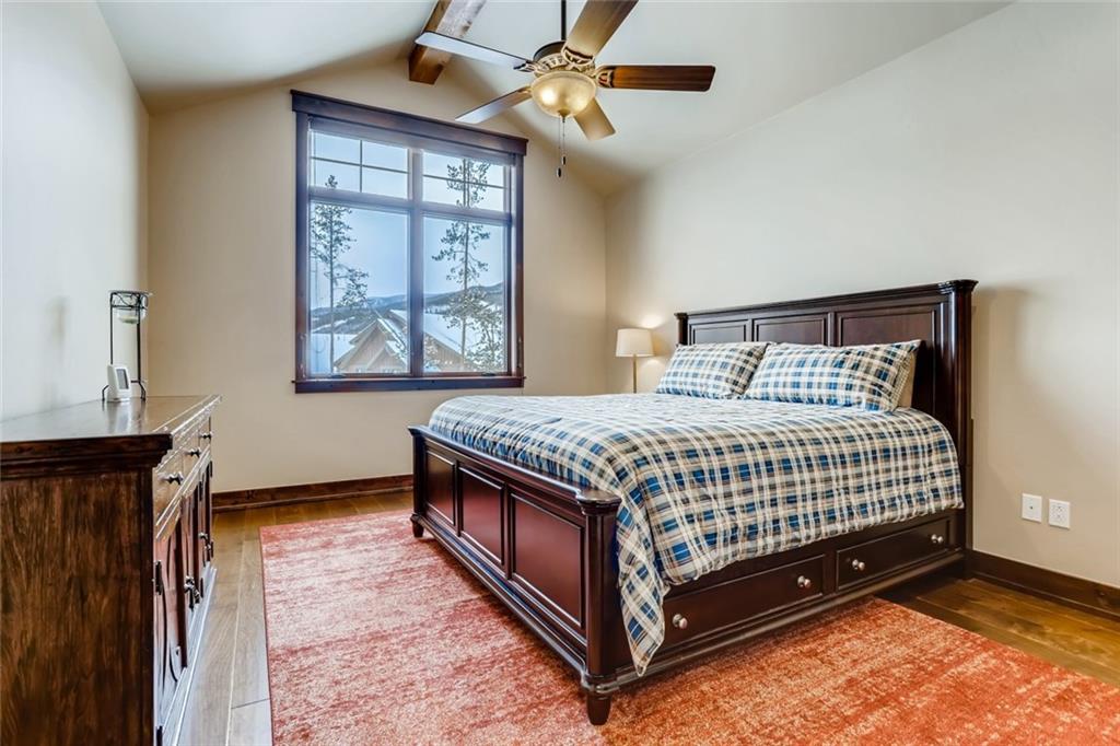 867 Independence Road, Unit 4A Keystone, CO 80435 - Photo 11 of 28 a bedroom with a bed a dresser and a window