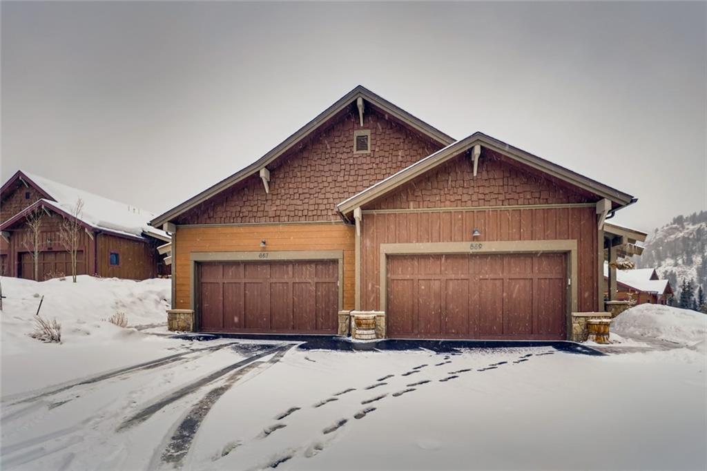 867 Independence Road, Unit 4A Keystone, CO 80435 - Photo 13 of 28 a front view of a house with a yard and garage