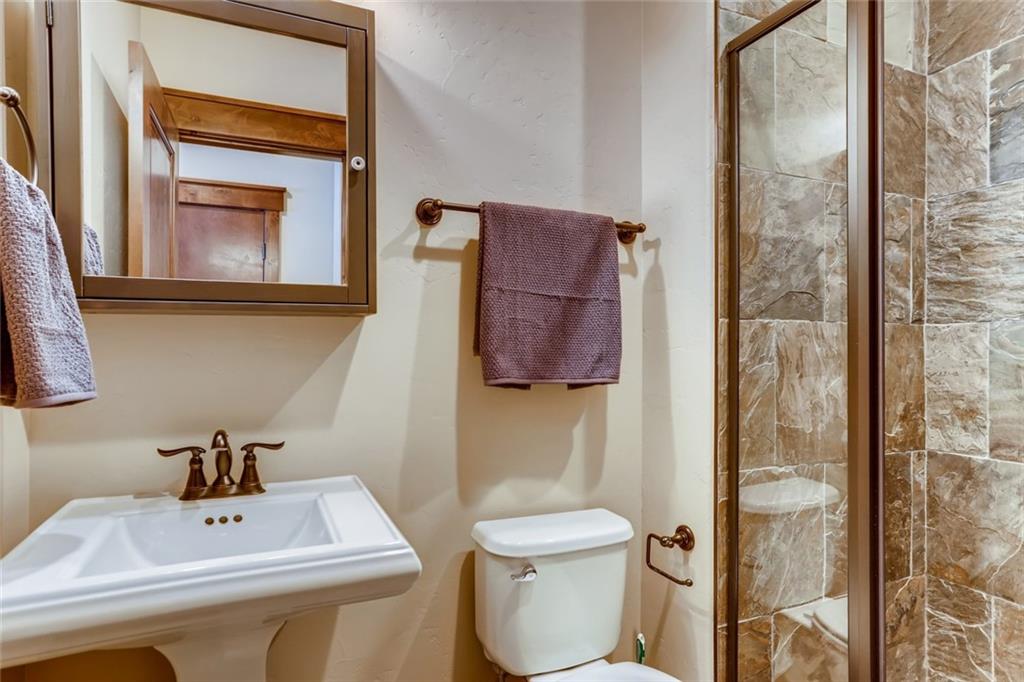 867 Independence Road, Unit 4A Keystone, CO 80435 - Photo 14 of 28 a bathroom with a sink toilet and shower