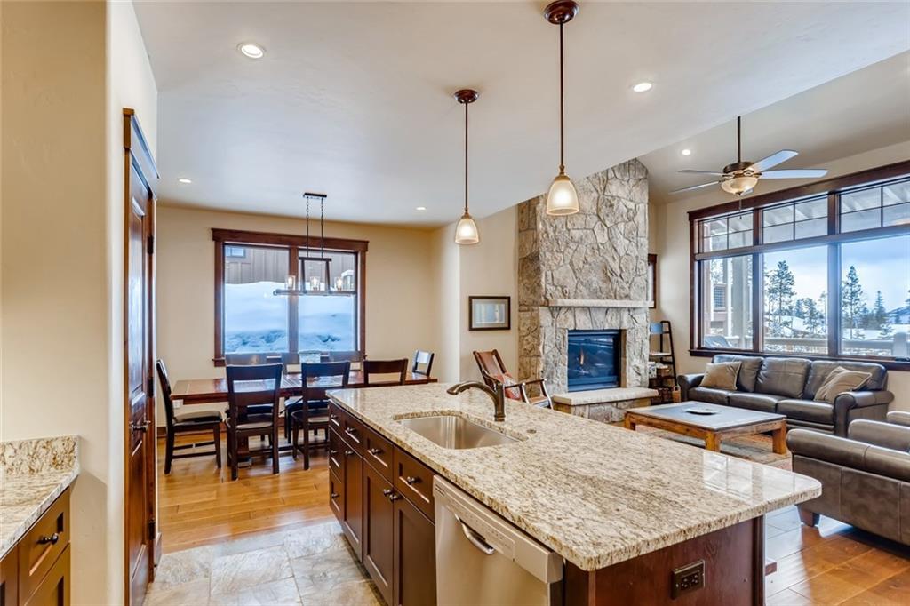 867 Independence Road, Unit 4A Keystone, CO 80435 - Photo 18 of 28 a kitchen with granite countertop a sink a counter top space and living room view