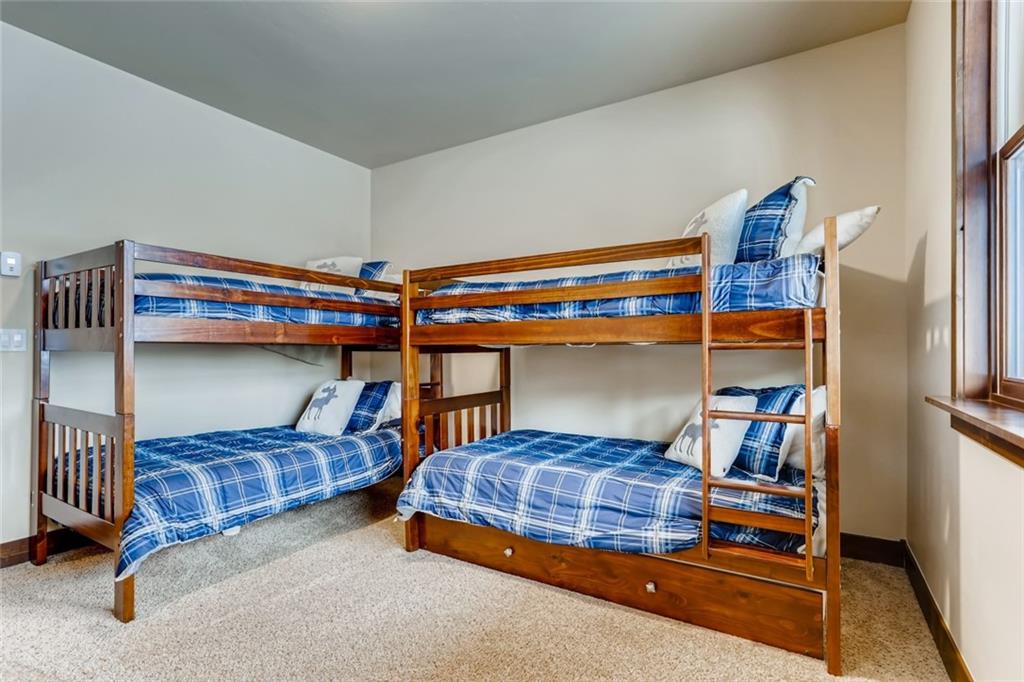 867 Independence Road, Unit 4A Keystone, CO 80435 - Photo 20 of 28 a bedroom with two beds and a lamp