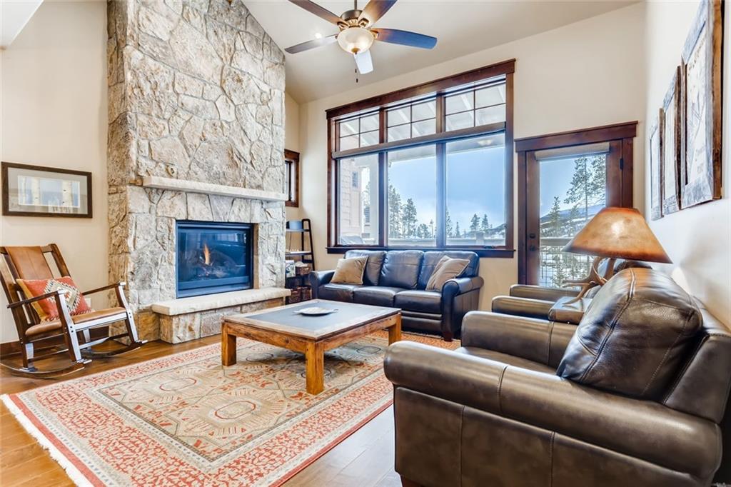 867 Independence Road, Unit 4A Keystone, CO 80435 - Photo 3 of 28 a living room with furniture a fireplace and a table