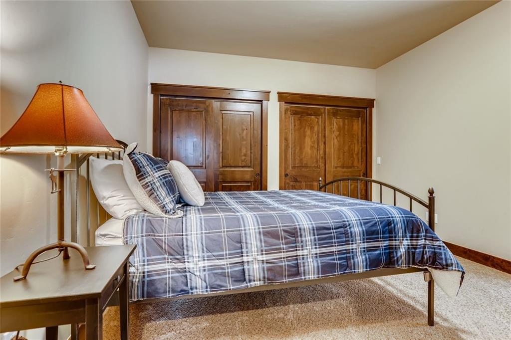 867 Independence Road, Unit 4A Keystone, CO 80435 - Photo 4 of 28 a bedroom with a bed and lamp