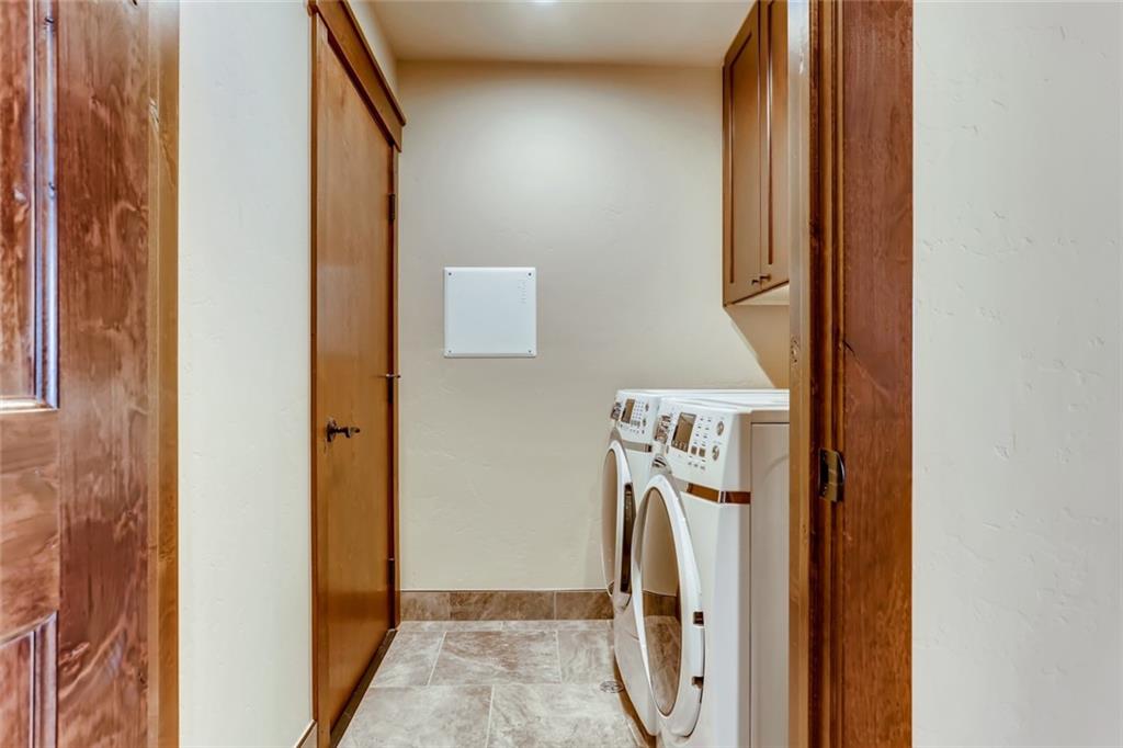 867 Independence Road, Unit 4A Keystone, CO 80435 - Photo 6 of 28 a utility room with dryer and washer
