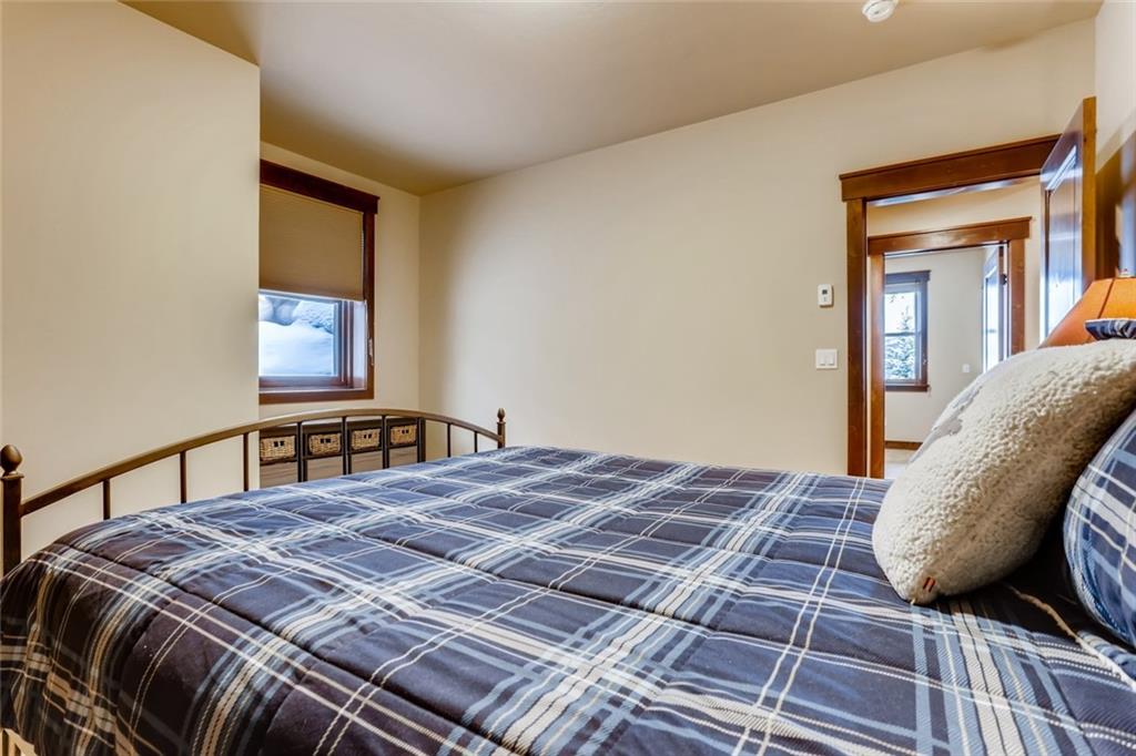 867 Independence Road, Unit 4A Keystone, CO 80435 - Photo 9 of 28 a bedroom with a bed next to a window