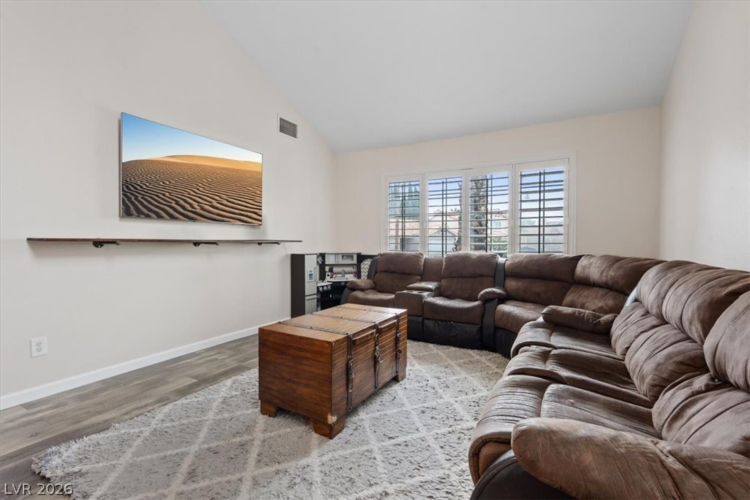2701 Purtell Circle Las Vegas, NV 89117 - Photo 6 of 17 Living area with vaulted ceiling and wood finished floors