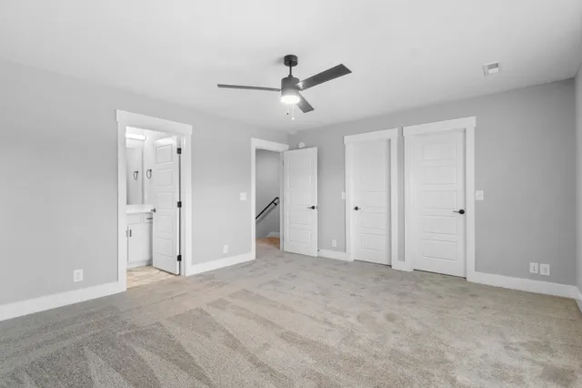 a bathroom with a sink toilet vanity and bathtub