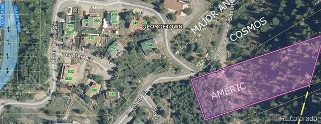 a view of a mountain with a yard