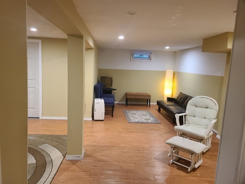 20 Johnson Street Ashland, MA 01721 - Photo 12 of 24 a living room with furniture and a couch