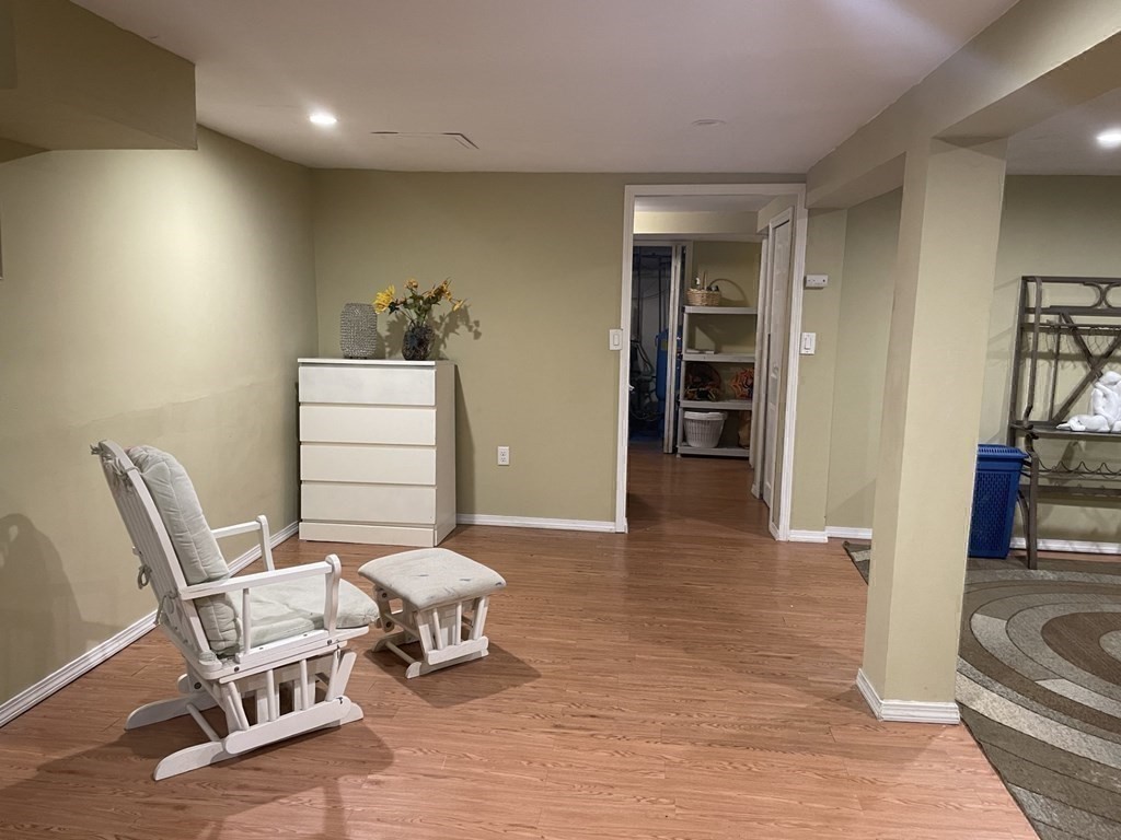 20 Johnson Street Ashland, MA 01721 - Photo 16 of 24 a living room with furniture and a chair