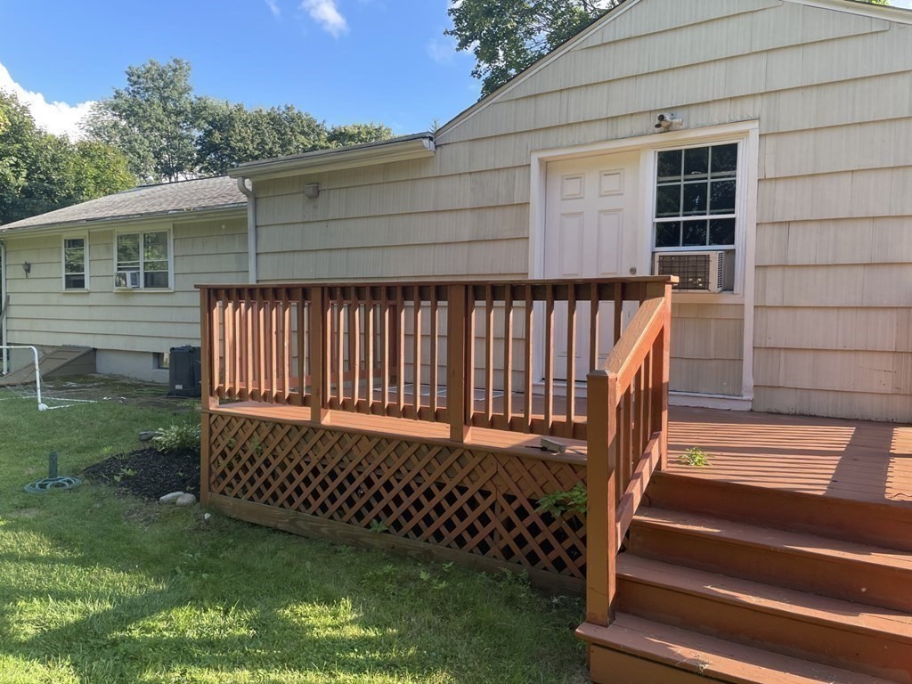 20 Johnson Street Ashland, MA 01721 - Photo 18 of 24 a view of a backyard with wooden fence