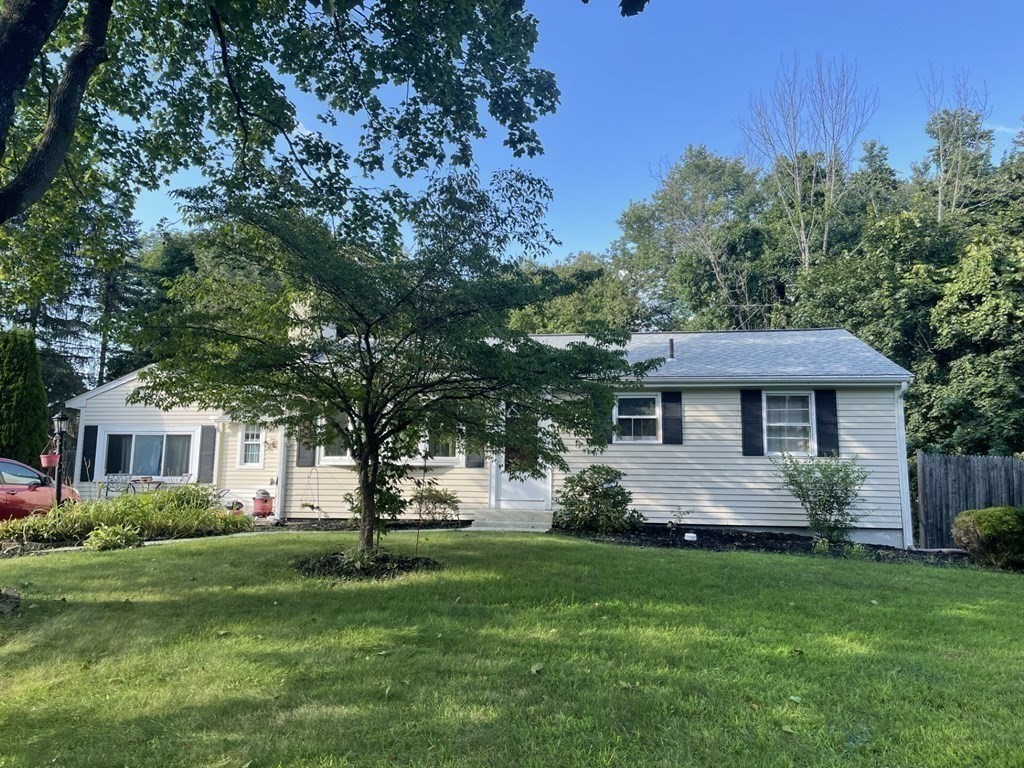 20 Johnson Street Ashland, MA 01721 - Photo 21 of 24 a front view of a house with a yard