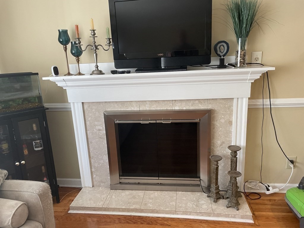 20 Johnson Street Ashland, MA 01721 - Photo 4 of 24 a view of living room with furniture and a fireplace