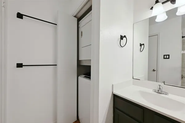 a bathroom with a sink and mirror
