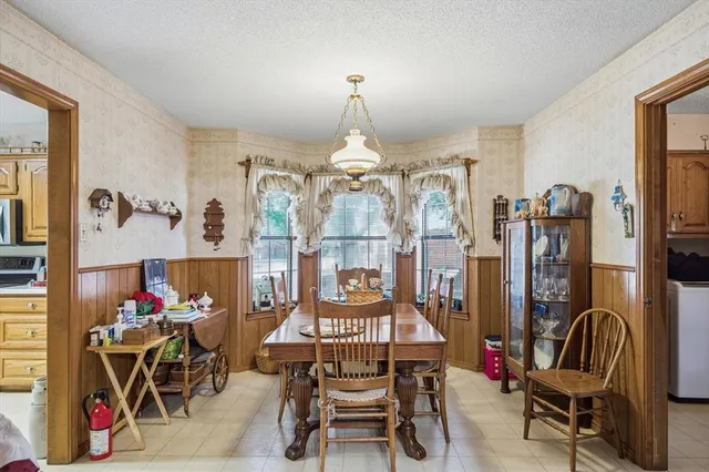 a view of a livingroom with furniture and lounge chair