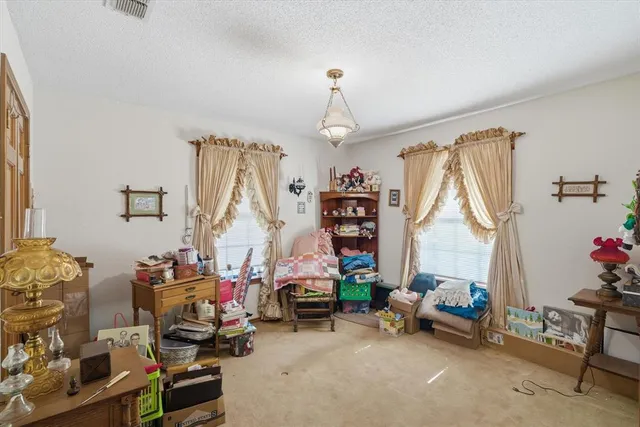 a bedroom with furniture a bed and a window