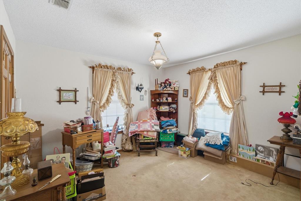 122 Bull Durham Road Wills Point, TX 75169 - Photo 18 of 33 a bedroom with furniture a bed and a window