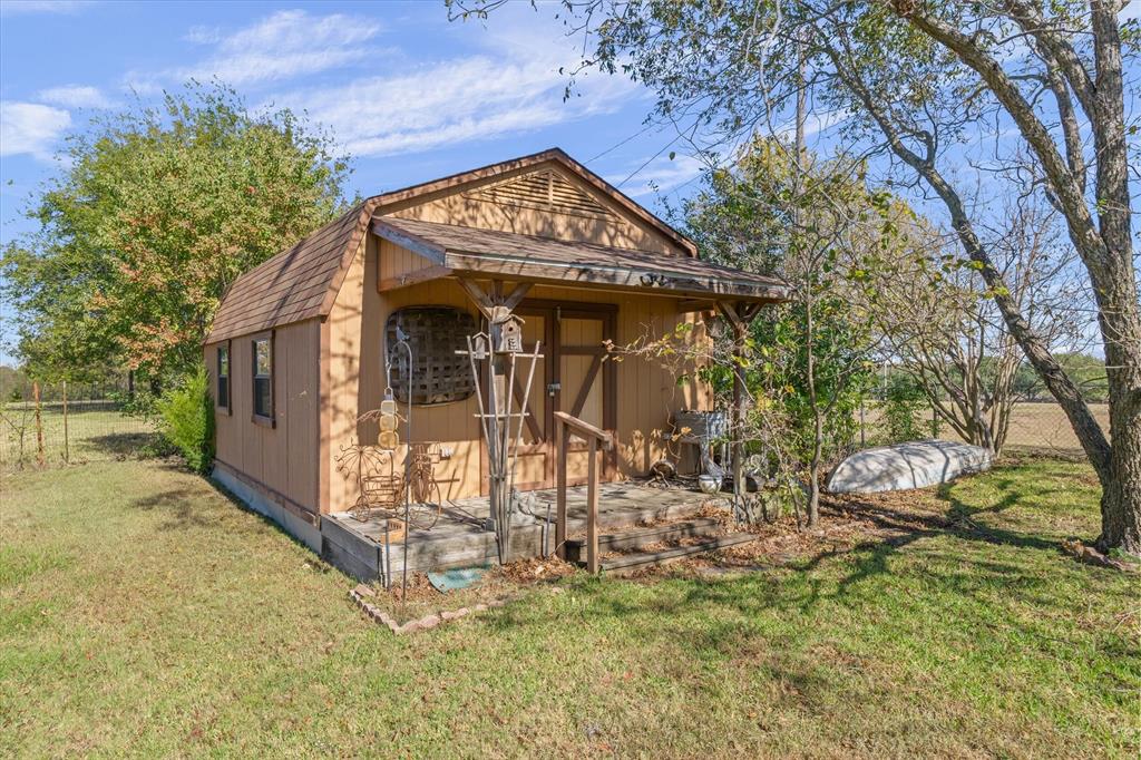 122 Bull Durham Road Wills Point, TX 75169 - Photo 24 of 33 a view of a house with a yard