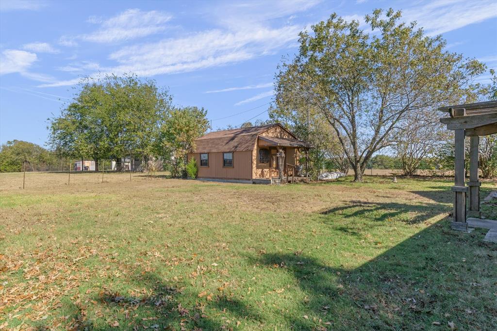 122 Bull Durham Road Wills Point, TX 75169 - Photo 26 of 33 a front view of a house with a yard
