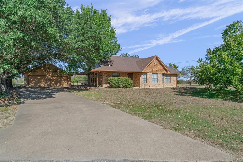 122 Bull Durham Road Wills Point, TX 75169 - Photo 28 of 33 a front view of a house with a yard and garage