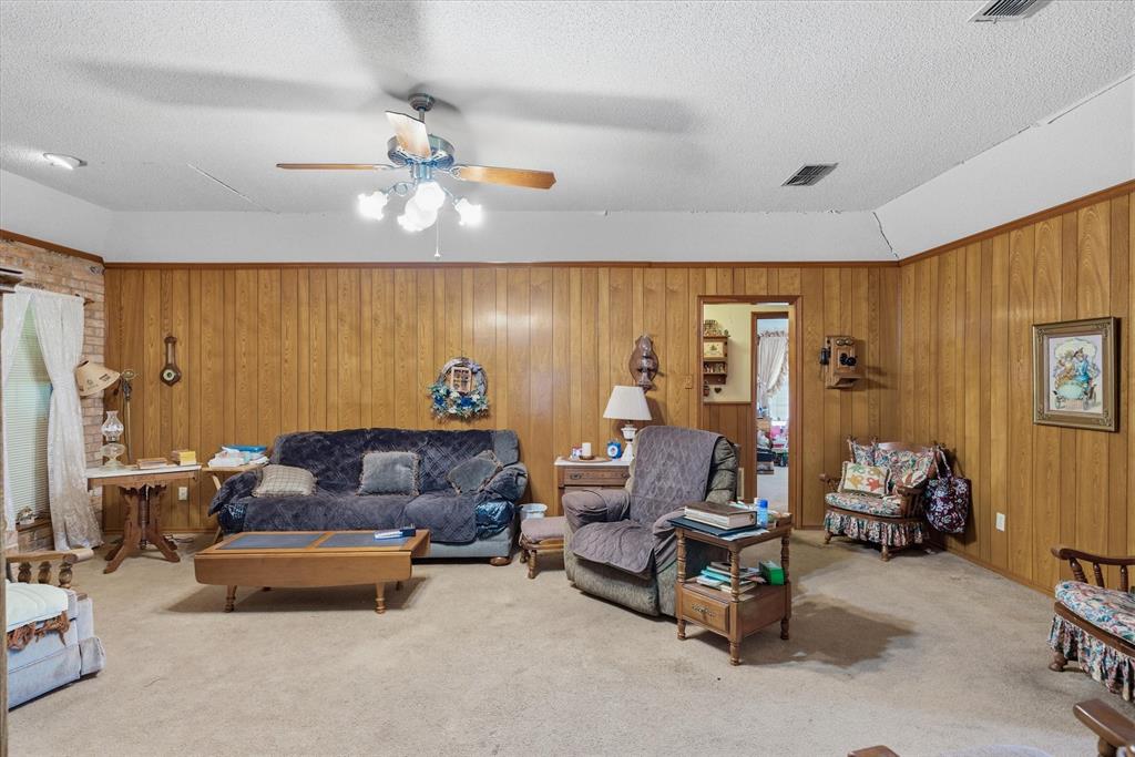 122 Bull Durham Road Wills Point, TX 75169 - Photo 7 of 33 a living room with furniture and a chandelier