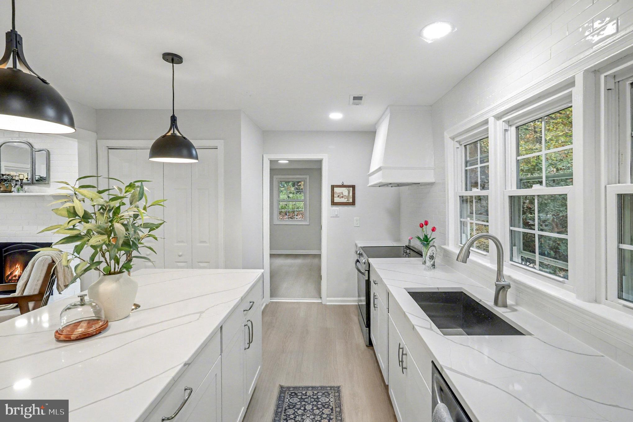 846 Borden Road Bumpass, VA 23024 - Photo 12 of 32 a kitchen with stainless steel appliances granite countertop a sink stove and refrigerator