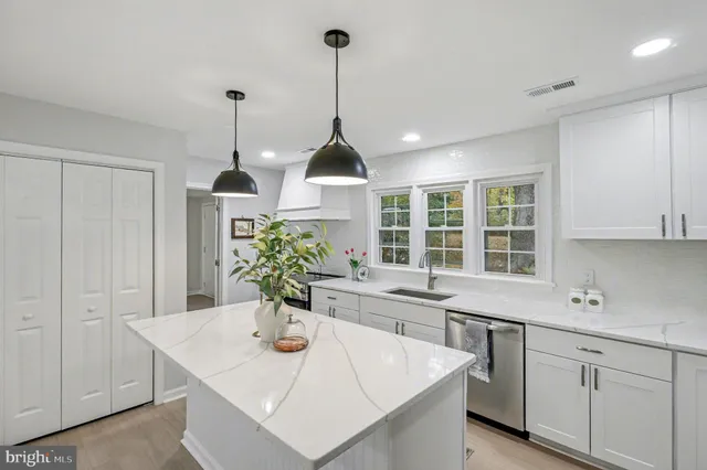 a kitchen with sink and window